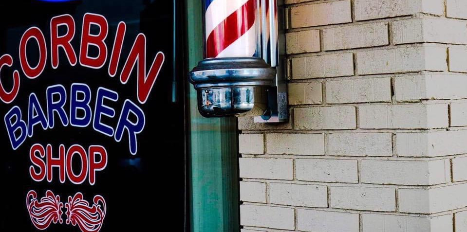 Corbin Barber Shop storefront with neon sign and barber pole
